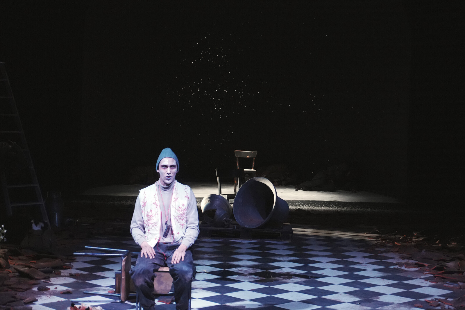 Rubble, roof tiles, a checkerboard floor, an actor, church bells