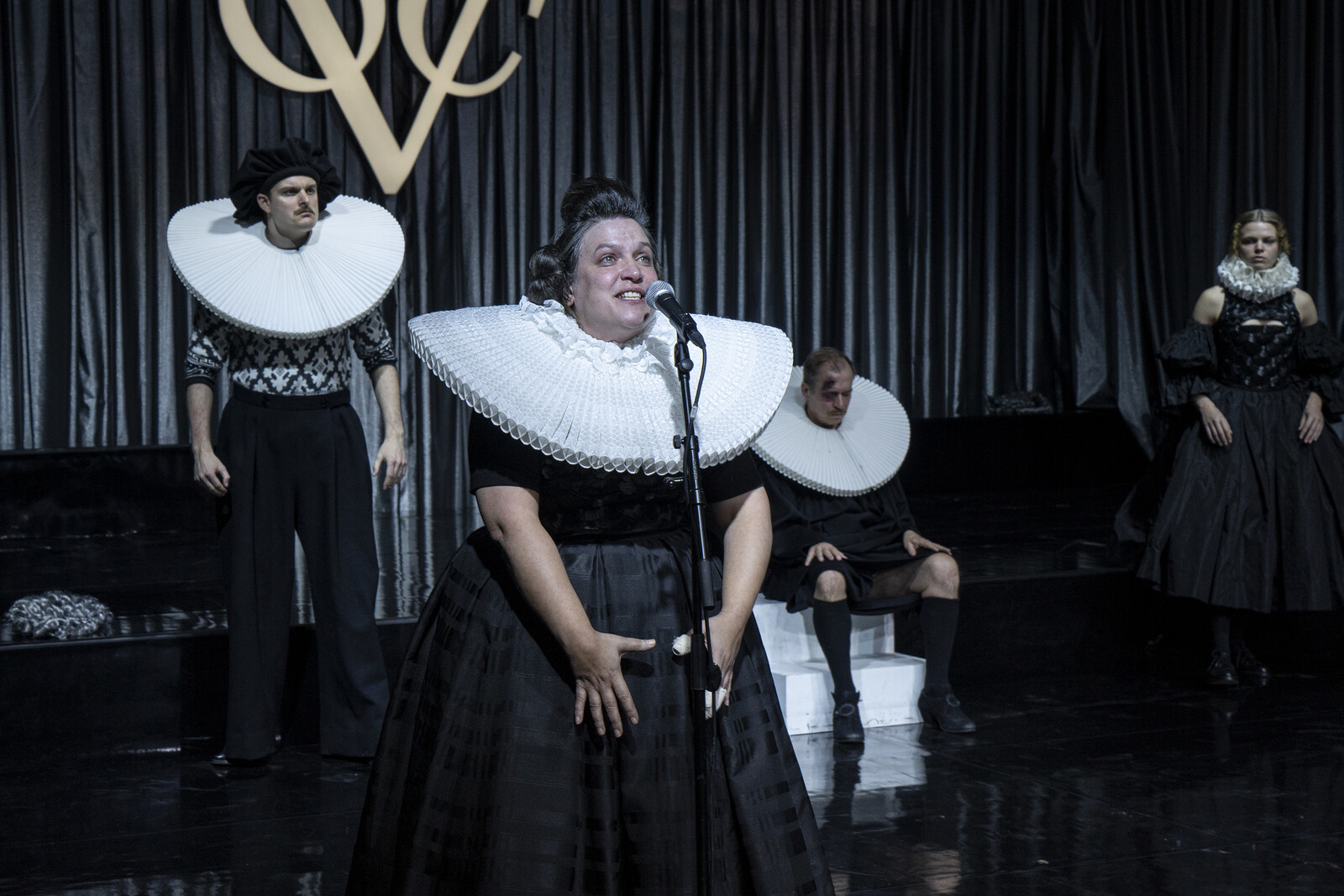 Mrs Marthe in the foreground at the microphone, behind her Ruprecht, Adam and Eve