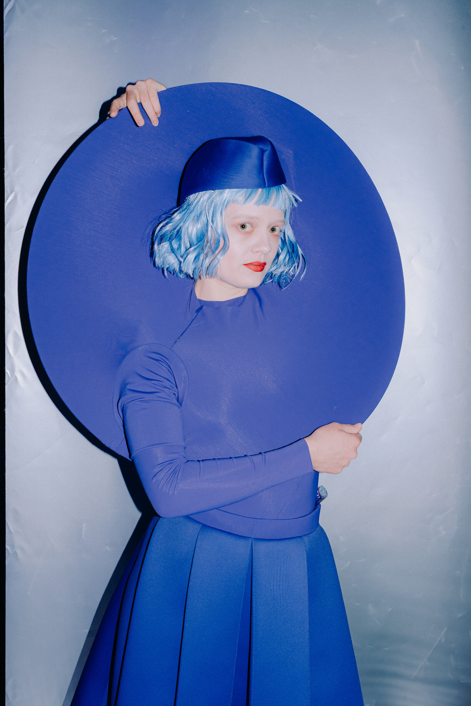 Actress Lea Reihl stands in front of the camera with her arms crossed.