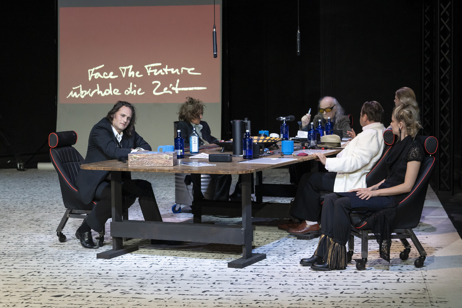 Actors in front of a poster