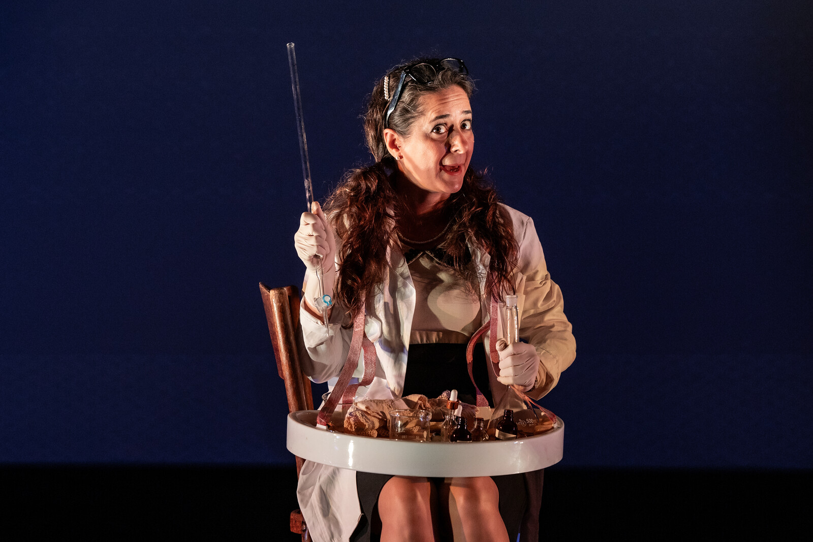 a women with wits on a chair with a tray on her lap