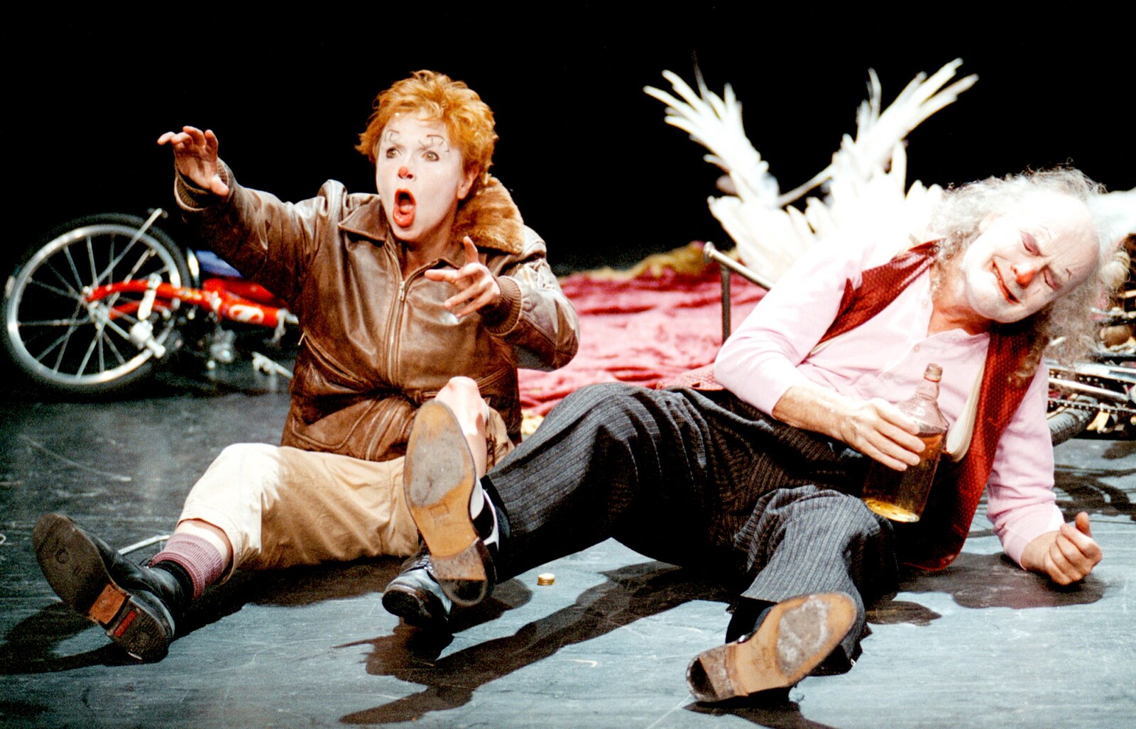 The actors sitting on stage