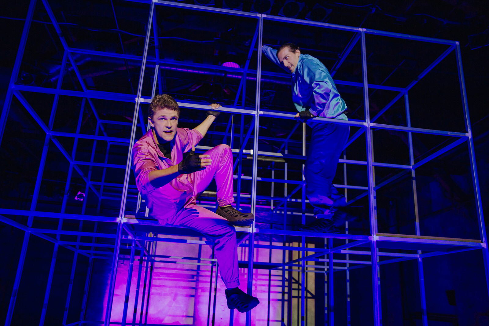 two people on a scaffold