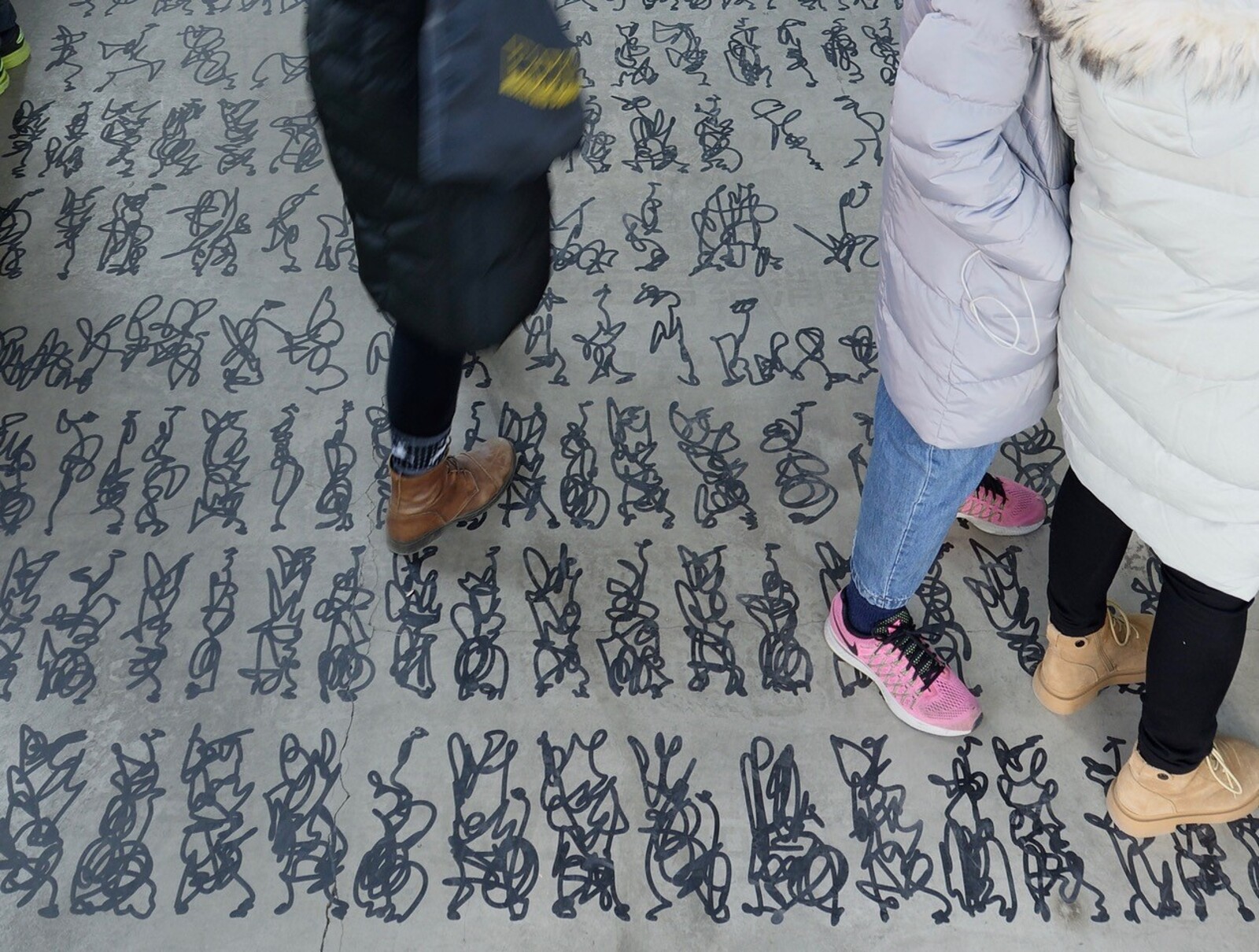 Feet on writing on the floor