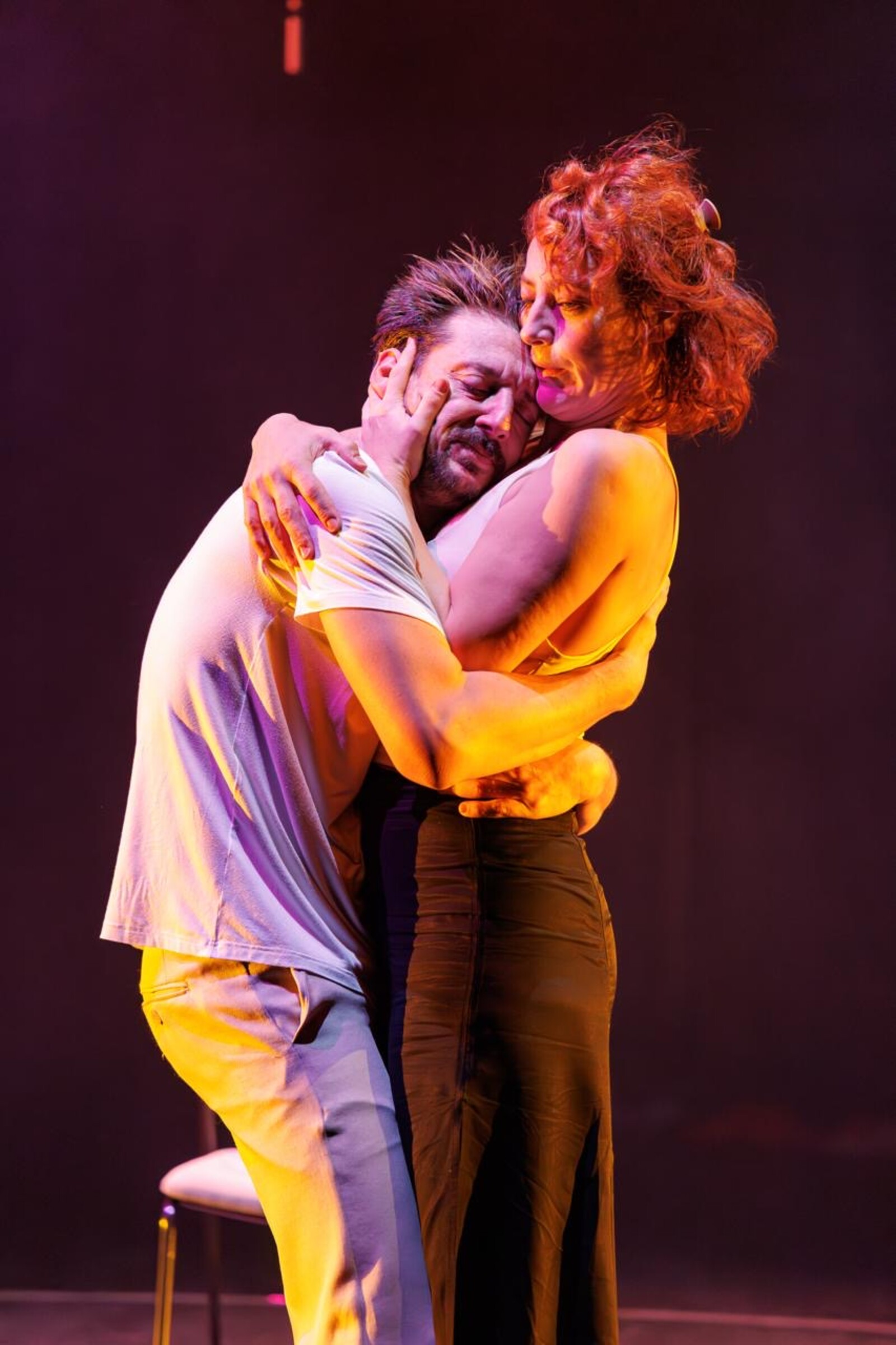 Two people are hugging